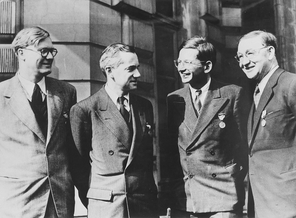 	William Penney, Otto Frisch, Rudolf Peierls and John Cockroft wearing the Medals of Freedom awarded for their services to the Manhattan Project