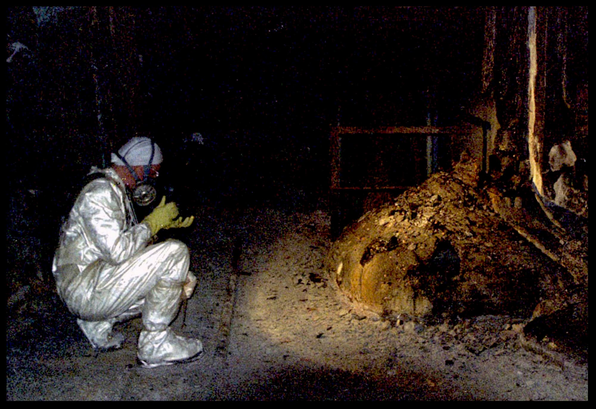The Elephants Foot of the Chernobyl disaster is shown in the immediate aftermath of the meltdown. The “Elephant’s Foot”, named for its appearance, is a solid mass made of melted nuclear fuel mixed with lots of concrete, sand and core sealing material that the fuel had melted through. It lies in a basement area under the original location of the core.